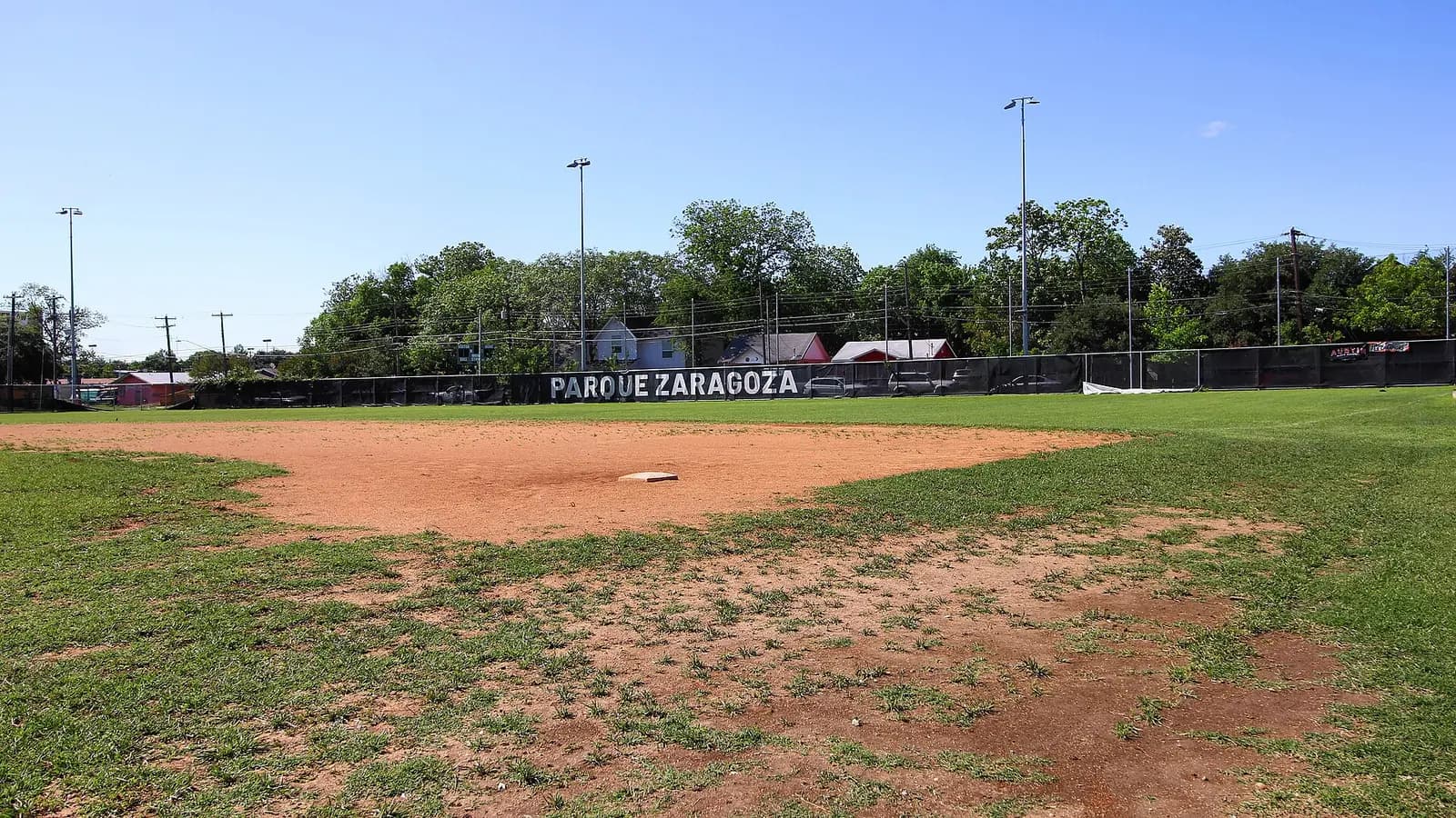Baseball field at Parque Zaragoza in East Austin viewed from the first-base dugout