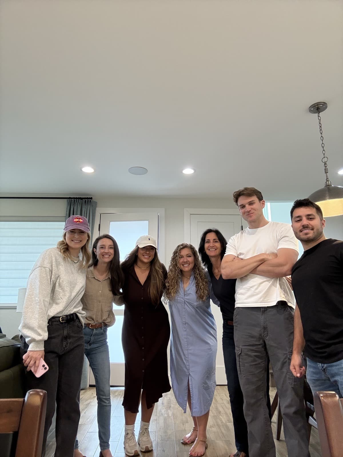 Seven KREW team members together during a home tour