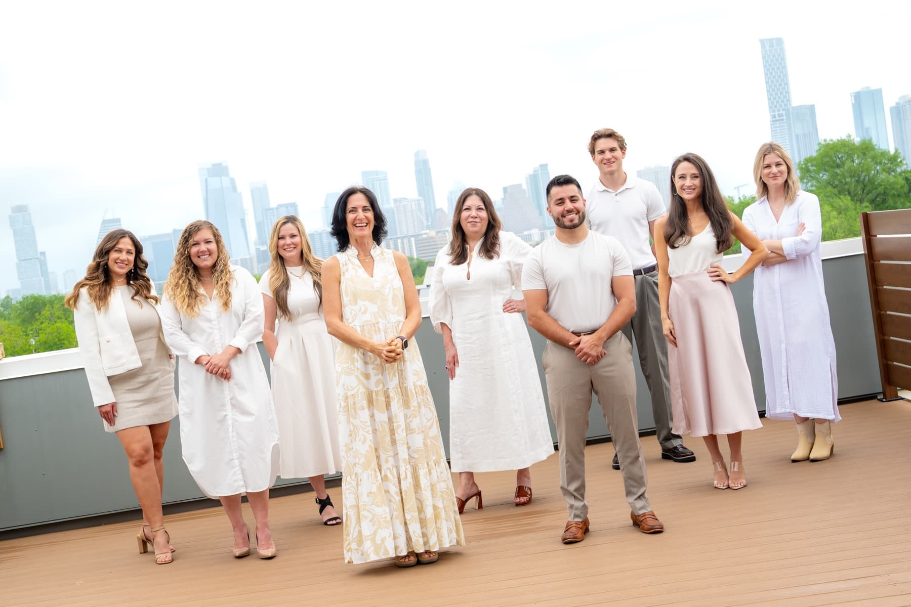 The Krew team together with the Austin skyline behind them